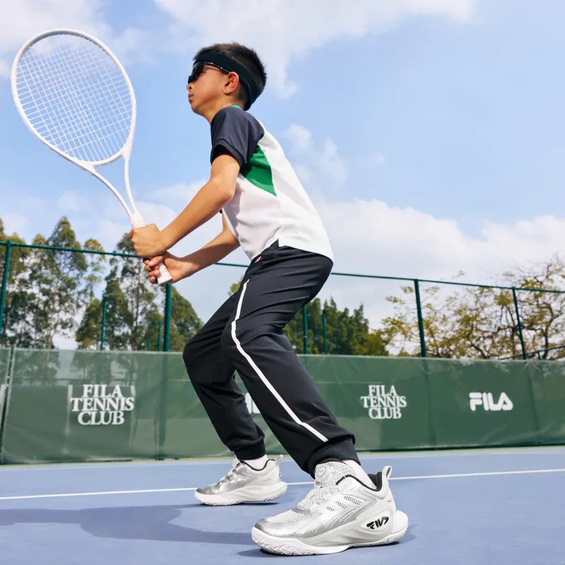 A lifestyle shot featuring FILA apparel.